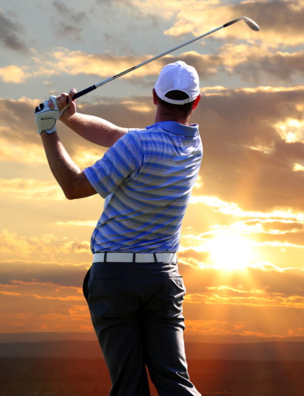 Richard Gompels finishing a swing at sunset